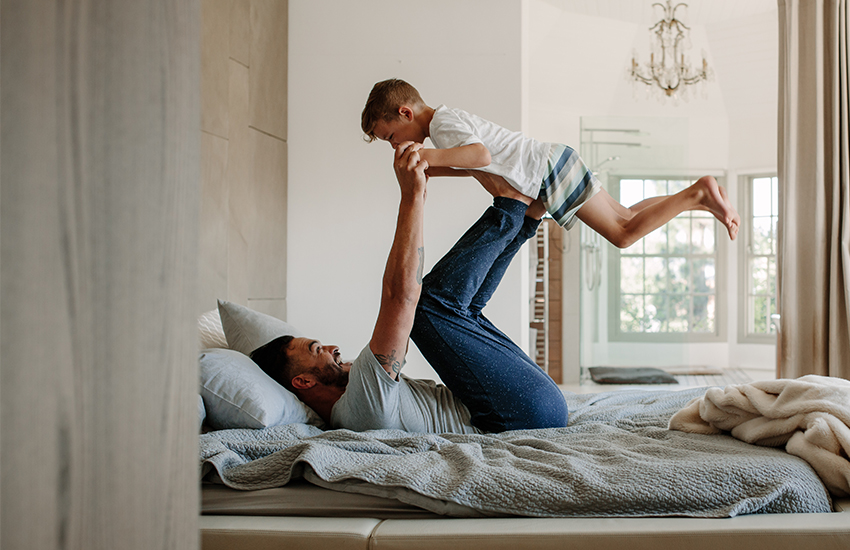 Father playing "Airplane" with his sone