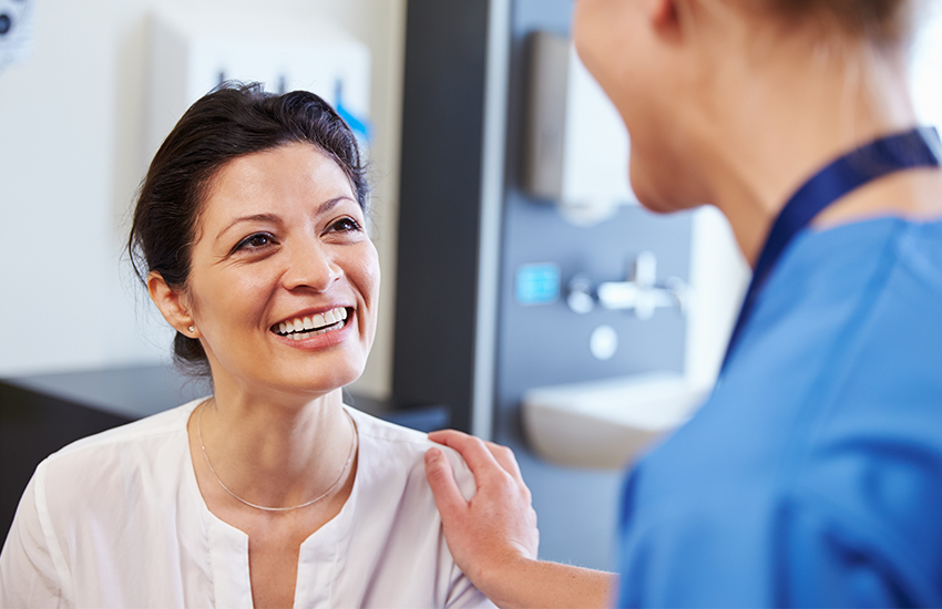 Doctor speaking with happy patient